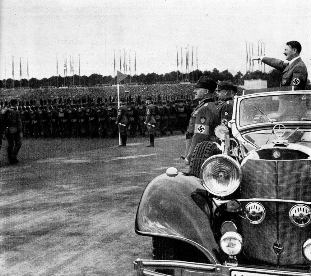 Adolf Hitler salutes during the parade of the RAD during the 1936 Reichsparteitag